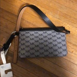 Brand new Michael Kors clutch purse.